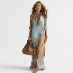 Printed shirt dress with V-neck, three-quarter sleeves, and full length hem, aqua and tan.