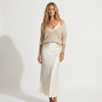 Madalina knit V-neck sweater over white satin midi dress, front view