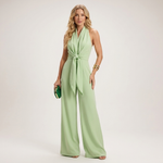 Airy halter jumpsuit in light green, sleeveless with waist tie and wide legs