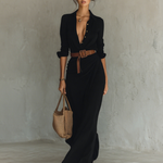 Black long-sleeve maxi dress with V-neck buttons and belted gathered waist, side view
