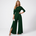 Green one-shoulder jumpsuit with long sleeves and wide-leg drape front