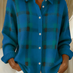 Blue plaid knit cardigan with button-front, V-neck collar, long sleeves.