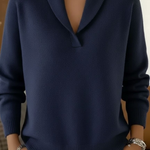 Navy V-neck knit sweater with long sleeves and ribbed cuffs and hem