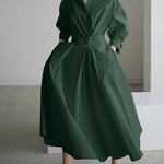 Dark green long button-front dress with puff sleeves and tied waist, A-line skirt