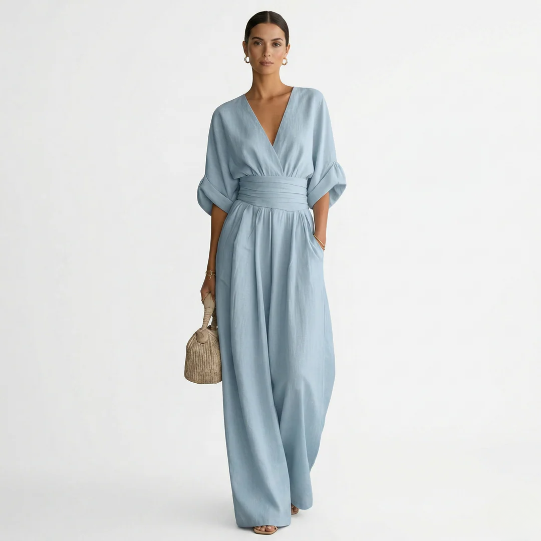 Light blue v-neck belted jumpsuit with gathered waist and wide-leg pants