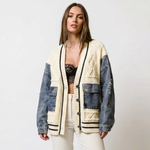 Patchwork cardigan with cream knit front, dark denim sleeves, black trim, button placket