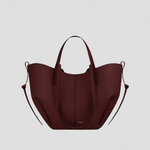 Large burgundy tote bag with top handles and side loop straps, curved open shape