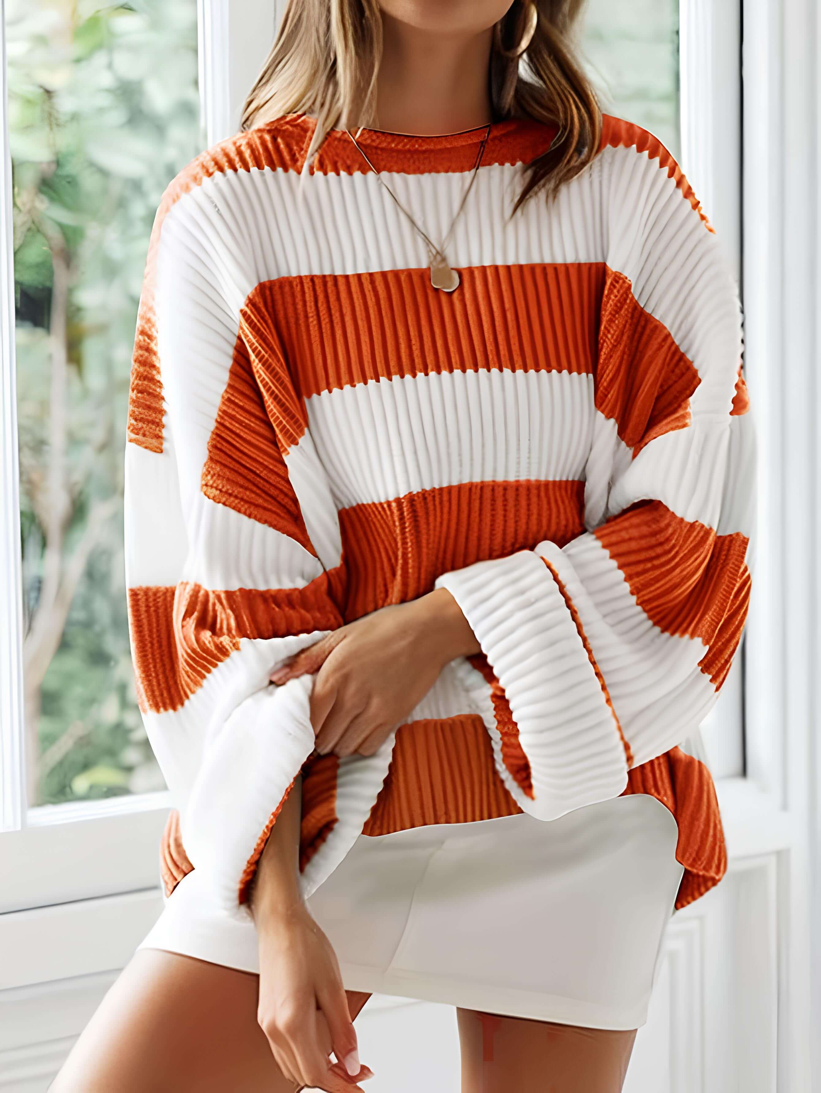 Women’s winter striped knit sweater in white and orange, crew neck, long sleeves