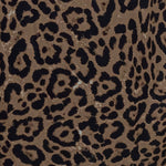 Leopard pattern fabric close-up in tan and dark brown