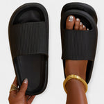 Black home and beach slippers with ribbed slide strap and open toe