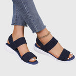 Navy orthopedic sandals with thick wide straps and white cushioned sole, open toe