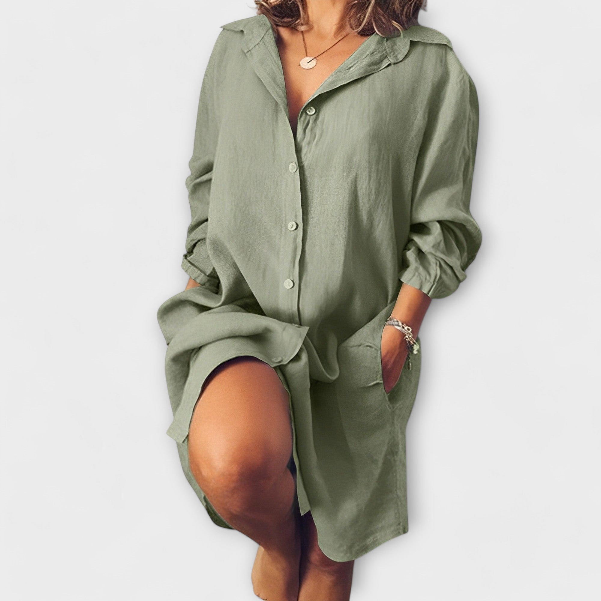 Loose linen shirt-dress, sage green, button-front, point collar, long sleeves, relaxed fit.