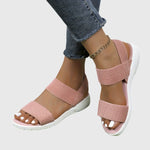 Light pink orthopedic sandals with two wide straps, open toe, white cushioned sole