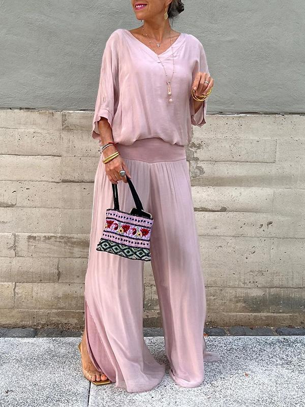 Two-piece chiffon set with short-sleeve blouse and wide-leg pants, soft blush pink.