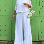 Two-piece chiffon set with loose blouse and wide-leg pants, white.