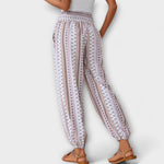 White multicolor patterned harem pants with elastic waist and balloon-style legs