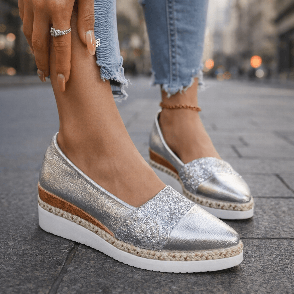 Silver glitter espadrille wedge sandal with V-cut upper and ankle chain detail