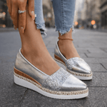 Silver glitter espadrille wedge sandal with V-cut upper and ankle chain detail