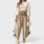 Beige wide-leg linen pants with elastic waist and ruffle cuffs