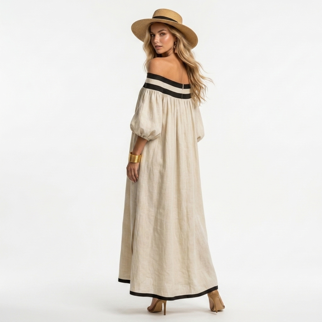 Beige long off-shoulder maxi dress with black-trim neckline stripe and full skirt.
