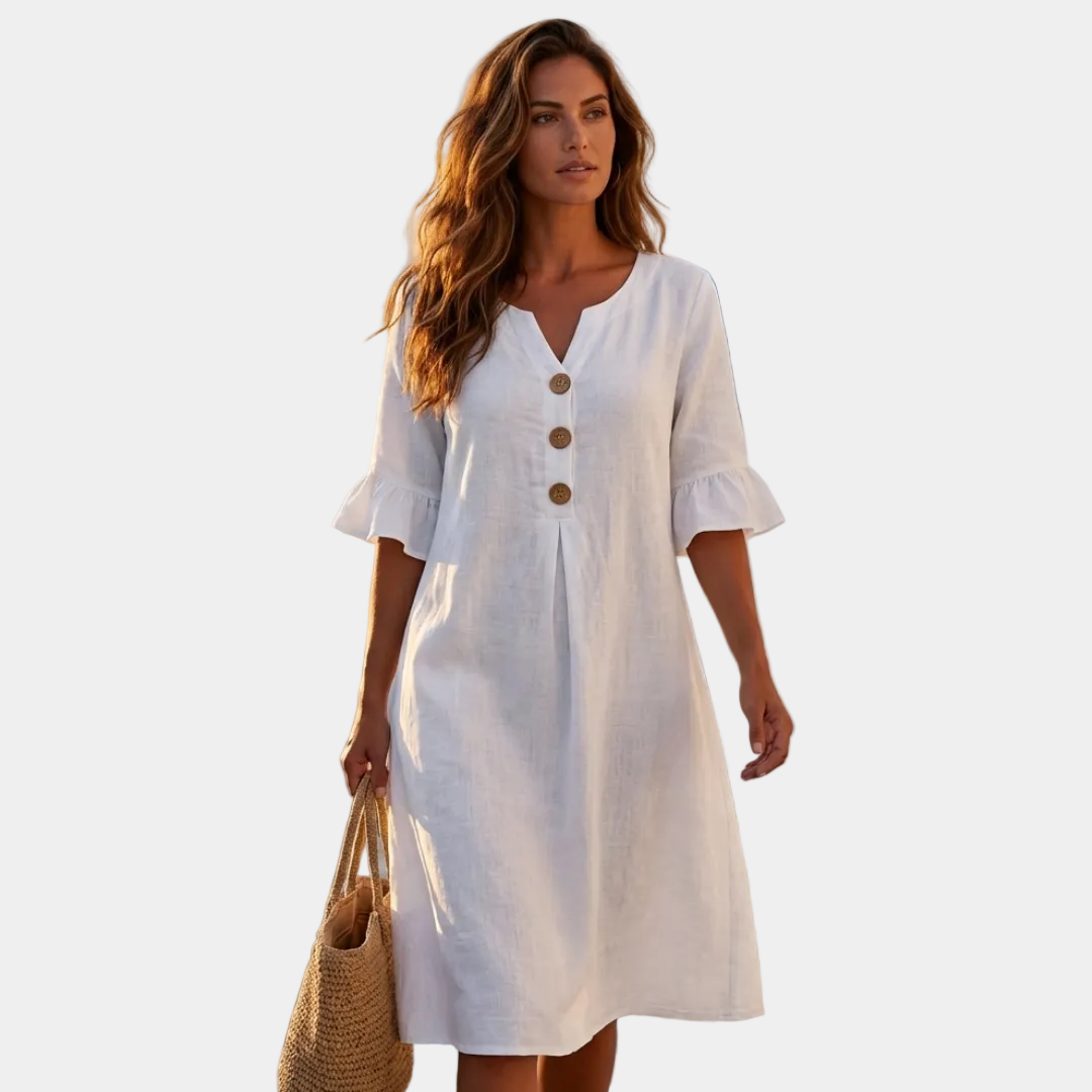 White linen dress with puff sleeves, button front, and V-neck with three buttons