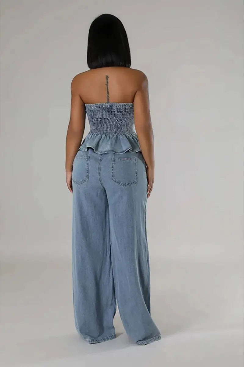 Back view of light blue denim set: strapless ruffled smocked top and wide-leg jeans