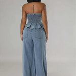 Back view of light blue denim set: strapless ruffled smocked top and wide-leg jeans