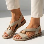 Flat slide sandals in light beige with wide strap and gold buckle ring