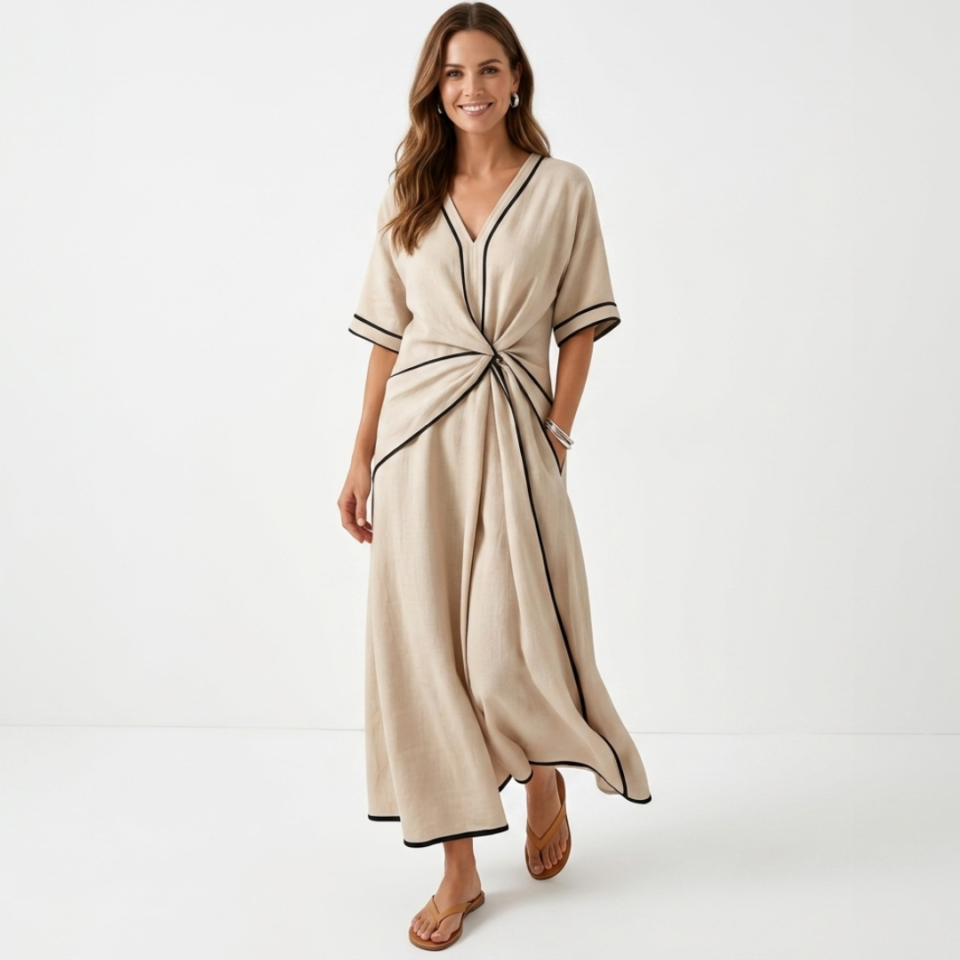 Beige sculpted-waist maxi dress with V-neck, short sleeves, and front waist tie.