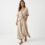 Beige sculpted-waist maxi dress with V-neck, short sleeves, and front waist tie.