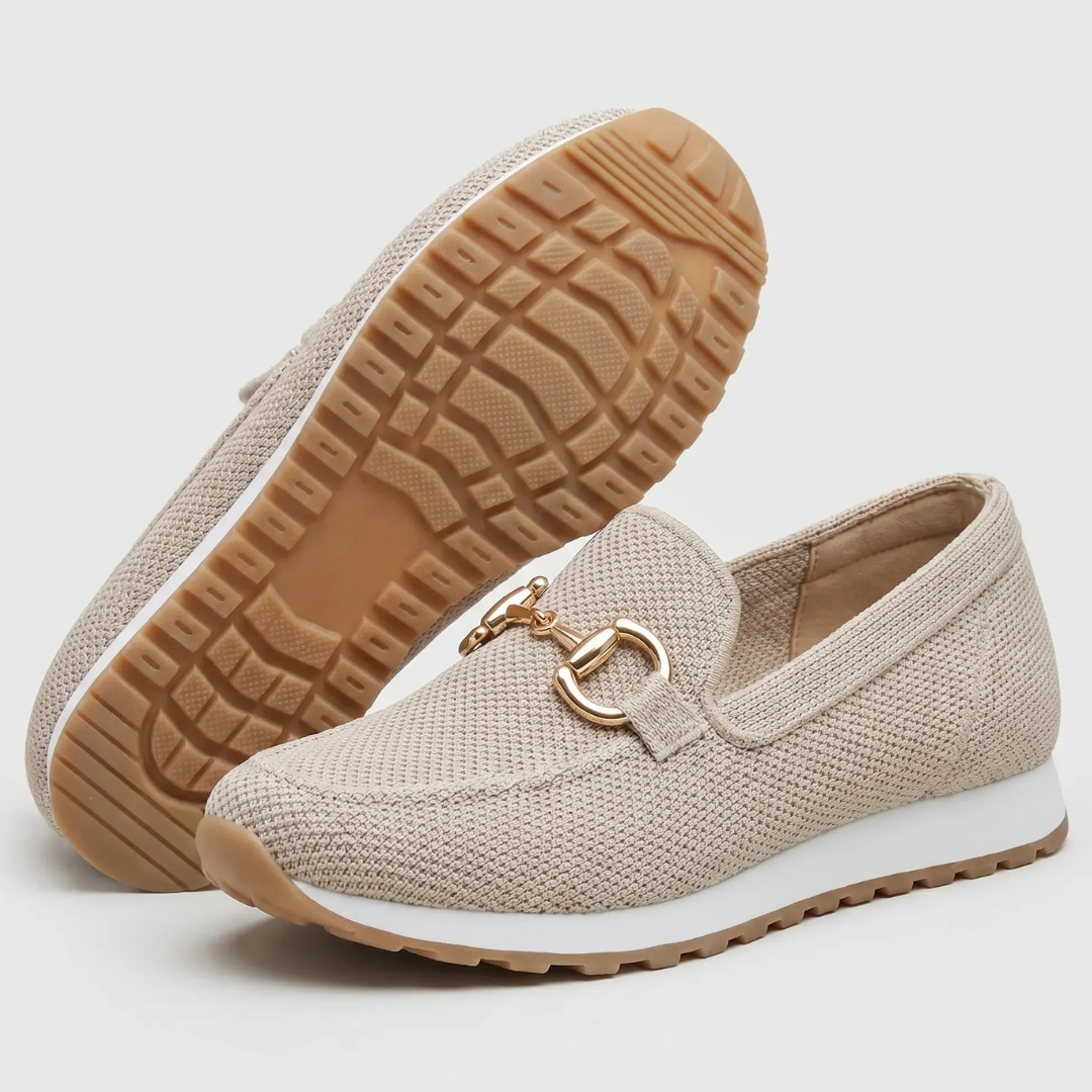 Beige orthopedic moccasin shoes, side view with gold-tone horsebit on textured fabric