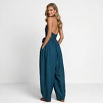 Women's dark teal halter jumpsuit with crossed back, tie waist, wide-leg pants