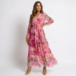 Luzia pink floral crossover wrap dress with V-neck, long sleeves, tiered skirt