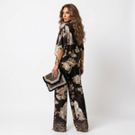 Black floral V-neck set, wide-leg pants with scalloped beaded mini handbag