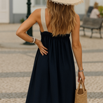 Elegant summer halter dress, dark navy with wide shoulder straps and flowy skirt