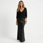 Madalina knit V-neck sweater over black satin maxi dress, front view