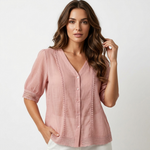 Light pink lightweight blouse, V-neck button front, short sleeves with eyelet trim.