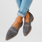 Gray suede leather moccasin loafers with stitched vamp and low wooden sole.
