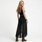 Black backless sleeveless top with layered sheer maxi skirt and belted waist
