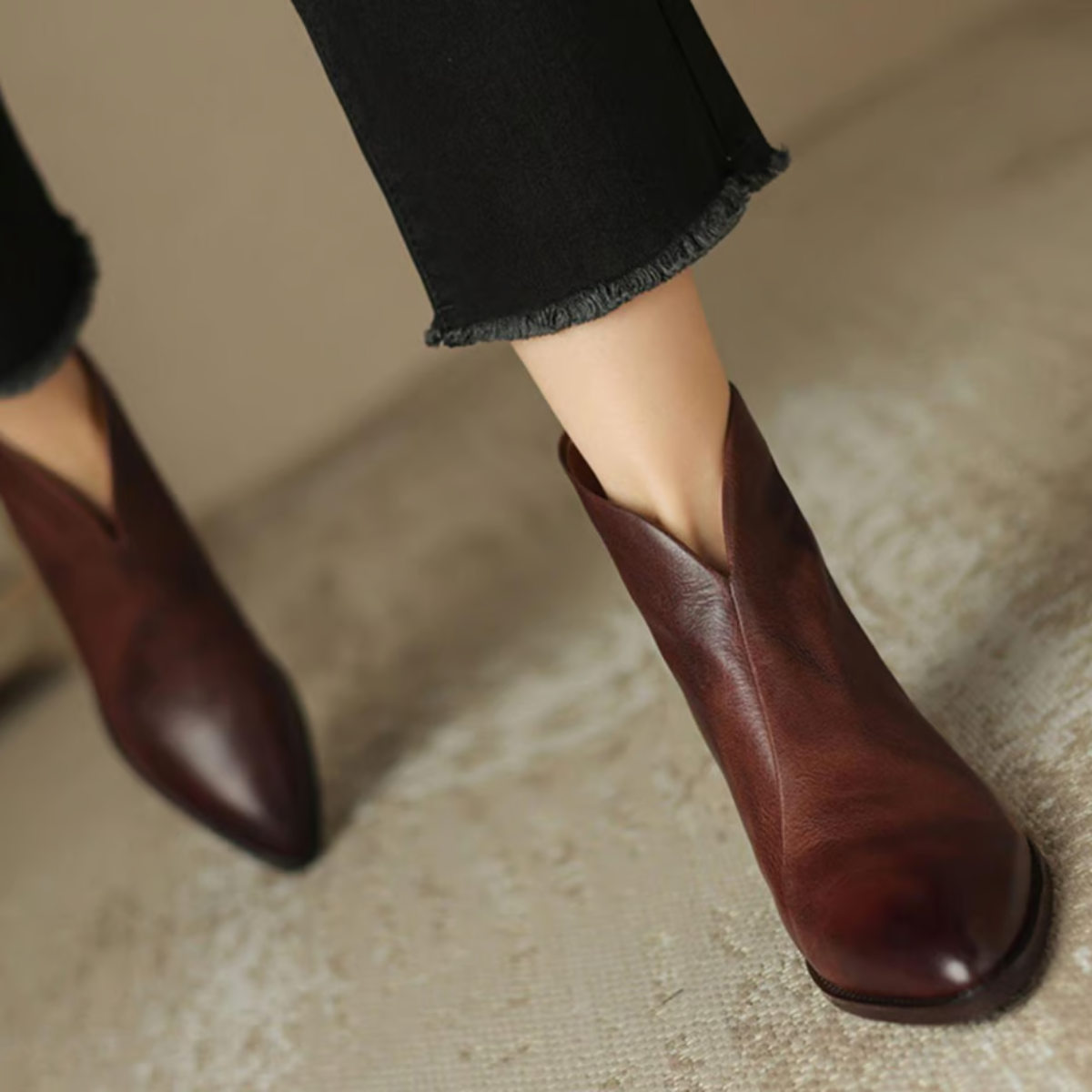 Brown leather ankle boots with low block heel and pointed toe