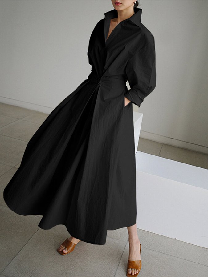 Black long wrap-style dress with puff sleeves and tied waist, swaying full skirt