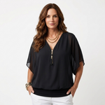 Black zip-front blouse with short dolman sleeves and V-neck placket