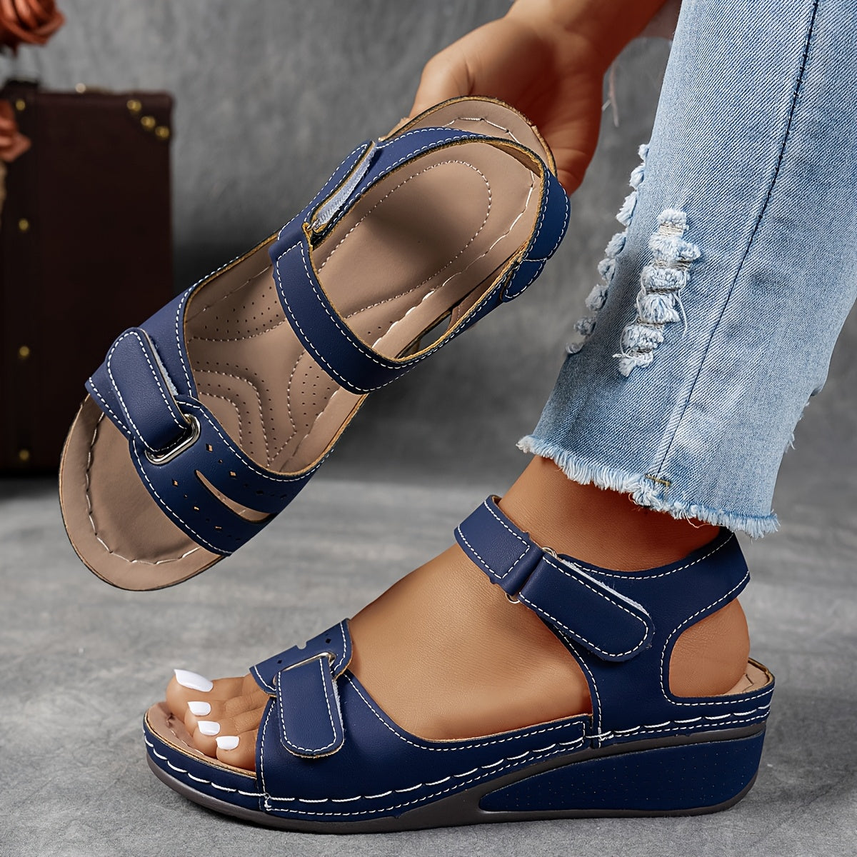 Navy orthopedic comfort sandals with hook-and-loop straps and cushioned wedge sole