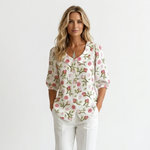 White floral button-front blouse with pointed collar and half sleeves