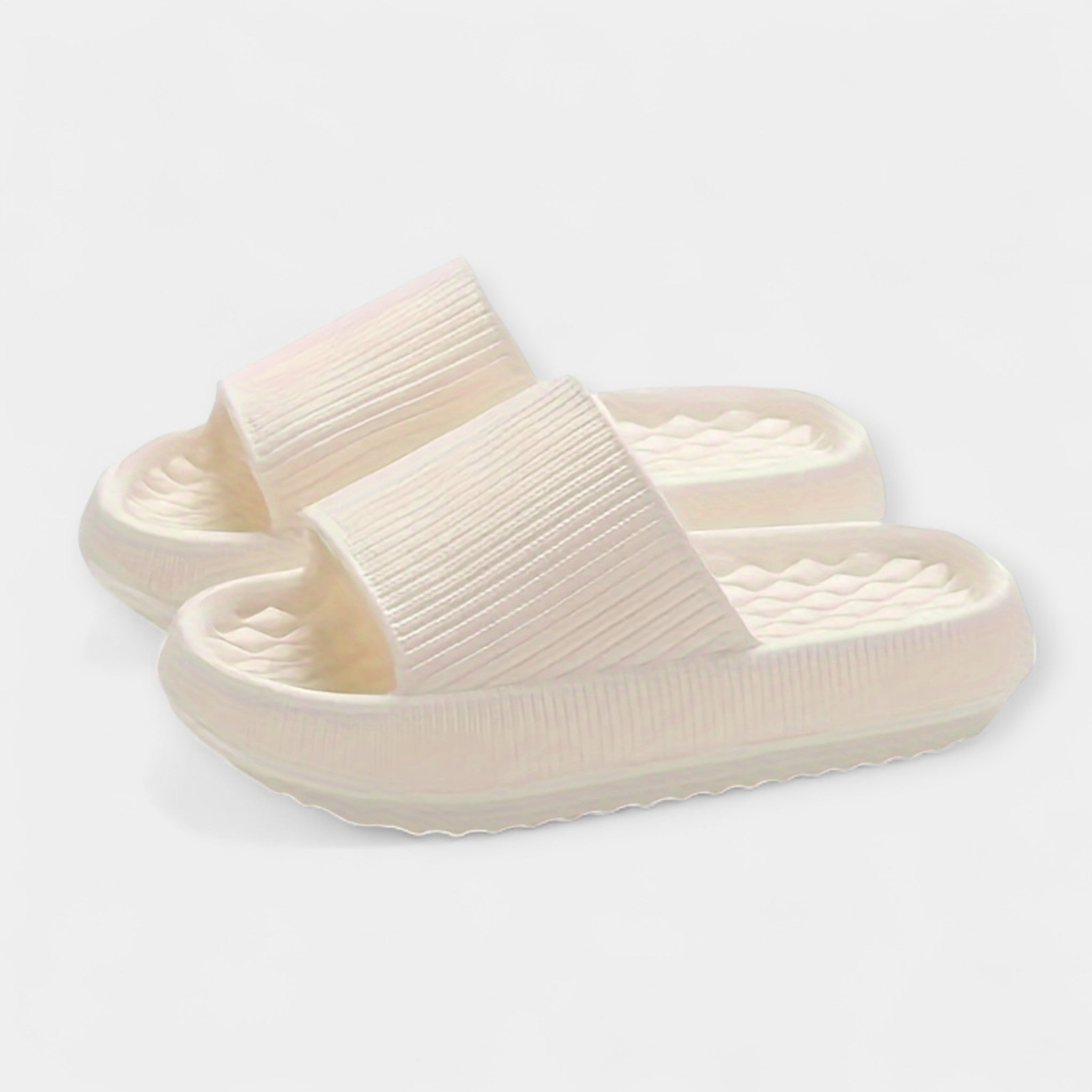 White textured slide sandals with wide strap and thick platform sole