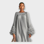 Long gray maxi dress with smocked yoke and layered ruffle cuffs