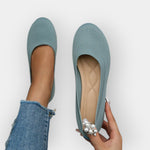 Light blue knit slip-on ballet flats with rounded toe and flat sole