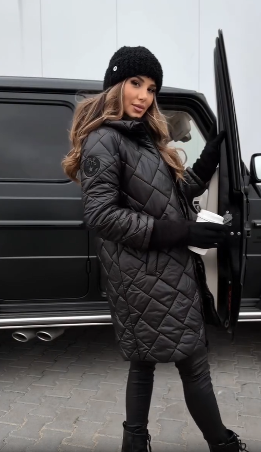 Black quilted puffer coat with hood, long sleeves, front zipper