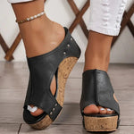 Black heeled wedge sandal, open toe, studded ankle strap and cork platform