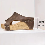 Brown heeled wedge sandal, open toe, studded side strap with cork sole